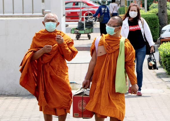 March 25, 2020, Bangkok, Thailand: Buddhist monks walk as they take a bus to leave from city at Bus Terminal in Bangkok on March 25, 2020. The government will declare an emergency and introduce new measures to combat the coronavirus disease 2019 (Covid-19) on Thursday26 March 2020, Prime Minister Prayut Chan-o-cha said. Bangkok Thailand - ZUMAu103 20200325_zia_u103_003 Copyright: xUrdeexImagex