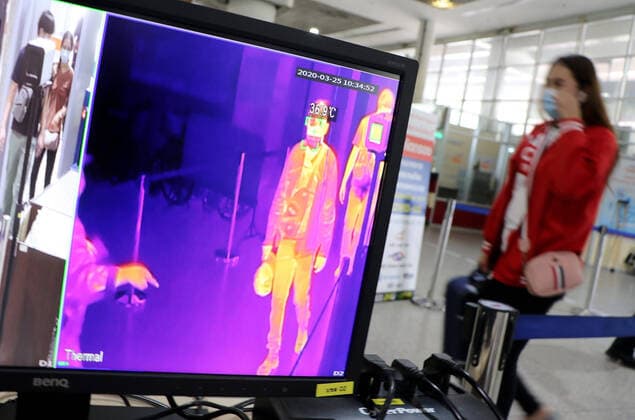March 25, 2020, Bangkok, Thailand: Passenger walks past a termo scan during the Coronavirus Covid-19 crisis at Bus Terminal in Bangkok on March 25, 2020. The government will declare an emergency and introduce new measures to combat the coronavirus disease 2019 (Covid-19) on Thursday26 March 2020, Prime Minister Prayut Chan-o-cha said. Bangkok Thailand - ZUMAu103 20200325_zia_u103_011 Copyright: xUrdeexImagex