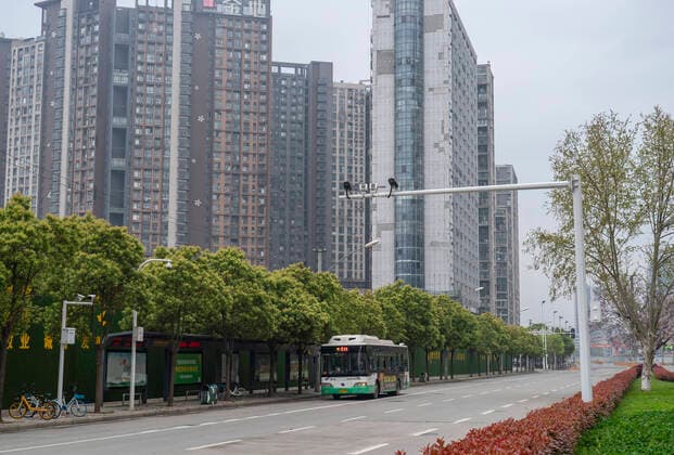 (200325) -- WUHAN, March 25, 2020 -- A bus runs on a road in Wuhan, central China s Hubei Province, March 25, 2020. Wuhan, the once hardest-hit city in central China s Hubei Province during the COVID-19 outbreak, resumed a total of 117 bus routes starting Wednesday, around 30 percent of the city s total bus transport capacity, the municipal transport bureau said. According to a spokesperson of the bureau, passengers must wear masks, register with their names and scan a QR code, and take a temperature check before taking buses and subways. ) CHINA-HUBEI-WUHAN-COVID-19-BUS ROUTES-RESUMPTION (CN) CaixYang