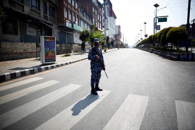 March 25, 2020, Lalitpur, Nepal: A policeman patrols the streets on the second day of the week long nationwide lockdown in an effort to control the spread of COVID-19 in Kathmandu, Nepal on Wednesday, March 25, 2020. Lalitpur Nepal - ZUMAg200 20200325_zap_g200_007 Copyright: xSkandaxGautamx