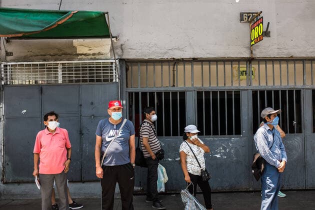 March 24, 2020, Lima, Peru: People wearing face masks as a precaution against the spread of Coronavirus wait at the bus stop..Due to the threat of the coronavirus pandemic, on March 15 President Vizcarra declared the national state of emergency and the suspension of the exercise of constitutional rights related to personal freedom and security, inviolability of the home and freedom of assembly and transit in the territory for 15 days. Currently, in Peru there are 416 registered cases and 7 deaths from Covid-19. Lima Peru - ZUMAs197 20200324_zaa_s197_218 Copyright: xSergixRugrandx