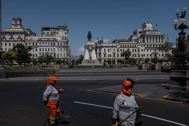 March 24, 2020, Lima, Peru: Municipal workers walk on an empty street in Lima..Due to the threat of the coronavirus pandemic, on March 15 President Vizcarra declared the national state of emergency and the suspension of the exercise of constitutional rights related to personal freedom and security, inviolability of the home and freedom of assembly and transit in the territory for 15 days. Currently, in Peru there are 416 registered cases and 7 deaths from Covid-19. Lima Peru - ZUMAs197 20200324_zaa_s197_219 Copyright: xSergixRugrandx