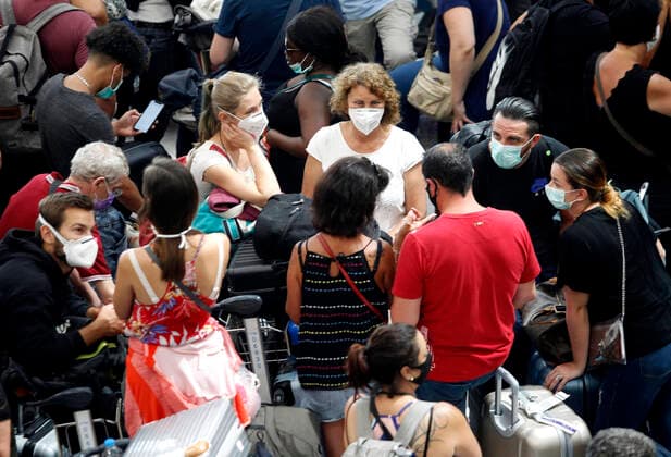 March 25, 2020, Bangkok, Thailand: Foreign tourists wait for check-in at Suvarnabhumi International airport in Bangkok on March 25, 2020. The government will declare an emergency and introduce new measures to combat the coronavirus disease 2019 (Covid-19) on Thursday26 March 2020, Thai Prime Minister Prayut Chan-o-cha said. Bangkok Thailand - ZUMAu103 20200325_zia_u103_015 Copyright: xUrdeexImagex