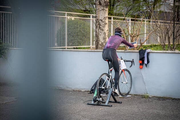 Milan - life in apartment buildings at the time of the Coronavirus. A man does bicycle training in the courtyard of his building in via Taormina, viale Marche area Editorial Usage Only  Copyright: xMarcoxPassarox xIPAx
