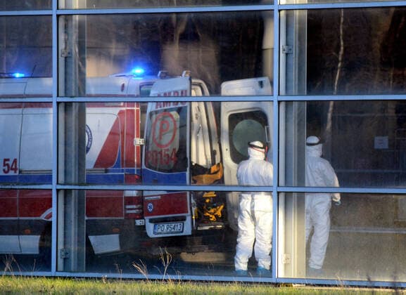 A patient is being transported to the isolation hospital in Poznan A patient is being transported to the isolation hospital during the coronavirus on March 24, 2020 in Poznan, Poland EN_01419881_0178 