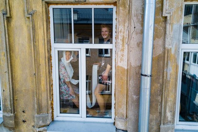 March 24, 2020, Vilnius, Lithuania: ALL PHOTOS WERE TAKEN WITH CONSENT AND WITH PERMISSION TO SHARE IMAGES**..A photographer has used his drone to capture images of people quarantined in their homes during the coronavirus pandemic...The heartwarming photos show how Lithuanian families are spending their time in lockdown, away from the outside world...Photographer Adas Vasiliauskas explained how due the cancellation of his usual advertising photography jobs he decided to make the most of social distancing and show how people are brought together in a time of isolation...Adas explains: At first I thought of offering to shoot people with a telephoto lens, but then I remembered I use a drone in my wedding photography and the drone is a totally zero-human-contact way to capture things. .. I shot a few of my friends, the photos gained a lot - ZUMAc218 20200324_zia_c218_029 Copyright: xCOVERxImagesx