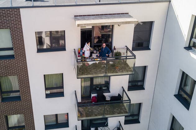 March 24, 2020, Vilnius, Lithuania: ALL PHOTOS WERE TAKEN WITH CONSENT AND WITH PERMISSION TO SHARE IMAGES**..A photographer has used his drone to capture images of people quarantined in their homes during the coronavirus pandemic...The heartwarming photos show how Lithuanian families are spending their time in lockdown, away from the outside world...Photographer Adas Vasiliauskas explained how due the cancellation of his usual advertising photography jobs he decided to make the most of social distancing and show how people are brought together in a time of isolation...Adas explains: At first I thought of offering to shoot people with a telephoto lens, but then I remembered I use a drone in my wedding photography and the drone is a totally zero-human-contact way to capture things. .. I shot a few of my friends, the photos gained a lot - ZUMAc218 20200324_zia_c218_050 Copyright: xCOVERxImagesx
