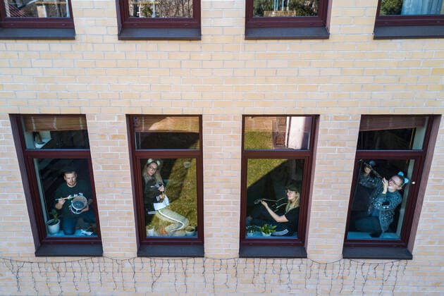 March 24, 2020, Vilnius, Lithuania: ALL PHOTOS WERE TAKEN WITH CONSENT AND WITH PERMISSION TO SHARE IMAGES**..A photographer has used his drone to capture images of people quarantined in their homes during the coronavirus pandemic...The heartwarming photos show how Lithuanian families are spending their time in lockdown, away from the outside world...Photographer Adas Vasiliauskas explained how due the cancellation of his usual advertising photography jobs he decided to make the most of social distancing and show how people are brought together in a time of isolation...Adas explains: At first I thought of offering to shoot people with a telephoto lens, but then I remembered I use a drone in my wedding photography and the drone is a totally zero-human-contact way to capture things. .. I shot a few of my friends, the photos gained a lot - ZUMAc218 20200324_zia_c218_039 Copyright: xCOVERxImagesx