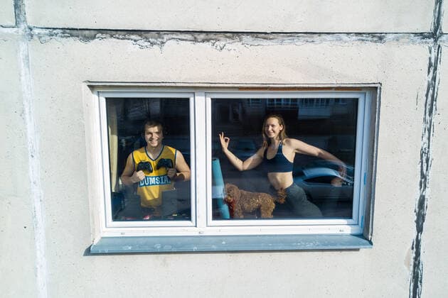 March 24, 2020, Vilnius, Lithuania: ALL PHOTOS WERE TAKEN WITH CONSENT AND WITH PERMISSION TO SHARE IMAGES**..A photographer has used his drone to capture images of people quarantined in their homes during the coronavirus pandemic...The heartwarming photos show how Lithuanian families are spending their time in lockdown, away from the outside world...Photographer Adas Vasiliauskas explained how due the cancellation of his usual advertising photography jobs he decided to make the most of social distancing and show how people are brought together in a time of isolation...Adas explains: At first I thought of offering to shoot people with a telephoto lens, but then I remembered I use a drone in my wedding photography and the drone is a totally zero-human-contact way to capture things. .. I shot a few of my friends, the photos gained a lot - ZUMAc218 20200324_zia_c218_040 Copyright: xCOVERxImagesx