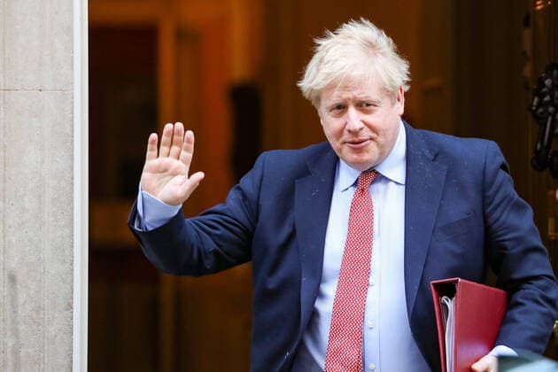 Britain s Prime Minister Boris Johnson waves to the media as he leaves 10 Downing Street for the House of Commons for his weekly Prime Ministers Questions, Wednesday, March 25, 2020. British lawmakers will vote later Wednesday to shut down Parliament for 4 weeks, due to the coronavirus outbreak. (Photo Vudi Xhymshiti)  iMagoVX