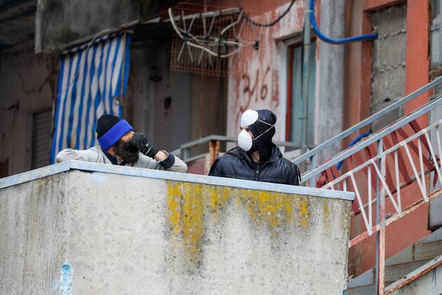 March 25, 2020, Naples, CAMPANIA, ITALY: 3 25 2020 Naples, in the northern suburbs of the Scampia district, the carabinieri weapon checks for quarantine to combat the pandemic of the covid-19 virus Naples ITALY - ZUMAs236 20200325_zap_s236_069 Copyright: xFabioxSassox