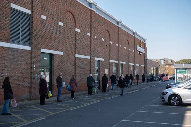 Shoppers queuing outside Morrisons in Sidcup, Kent during the Coronavirus (COVID-19) outbreak where travel has been restricted across the country at Sidcup, England on 25 March 2020. Copyright: xAlanxStanfordx PMI-3450-0011
