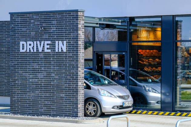 A car driver waits for his order at a drive-in counter of a bakery in Coswig on 25 03 2020