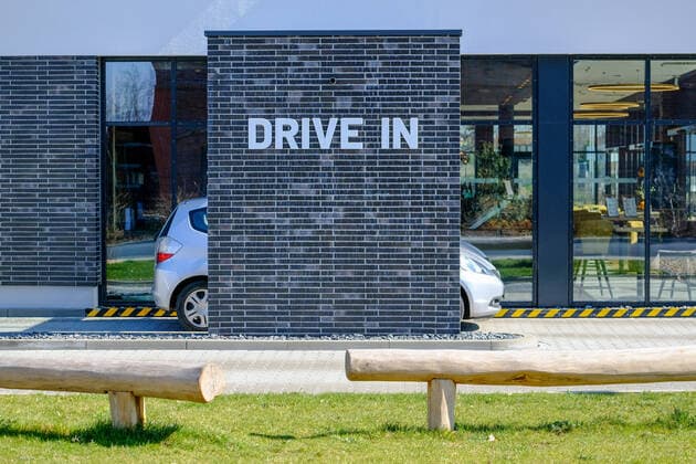 A car driver waits for his order at a drive-in counter of a bakery in Coswig on 25 03 2020