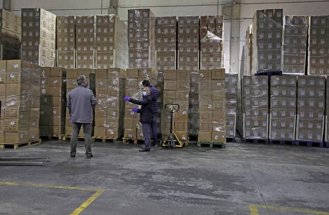 Workers sort out all the personal protective equipment (PPE) received from China at a warehouse in Valencia, Spain, 25 March 2020. A total of 3,800,000 masks, 5,000 protective suits and 2,000,000 gloves arrived to Valencia region to equip hospitals and elder homes in the need of this material amid the coronavirus outbreak. Spain is on its 11th consecutive day of national lockdown imposed by the government in an attempt to slow down the spread of the pandemic COVID-19 disease caused by the SARS-CoV-2 coronavirus. Protection material arrives to Spain from China !ACHTUNG: NUR REDAKTIONELLE NUTZUNG!  Copyright: xJuanxCarlosxCárdenasx GRAFCVA3414 20200325-637207248955790238