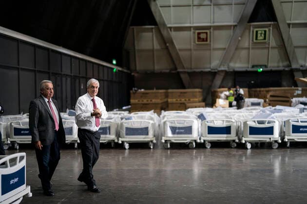 (200325) -- SANTIAGO, March 25, 2020 -- Chilean President Sebastian Pinera (R) and Health Minister Jaime Manalich visit Espacio Riesco Convention Center in Santiago, capital of Chile on March 24, 2020. The center will be converted into a temporary hospital for patients infected with COVID-19. Chile has had 922 confirmed cases of COVID-19 with two deaths, the Health Ministry reported Tuesday. CHILE-SANTIAGO-COVID-19-TEMPORARY HOSPITAL YinxNan 