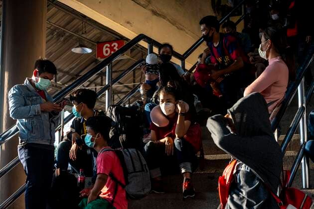 March 25, 2020, Bangkok, Bangkok, Thailand: Prime Minister Prayut Chan-O-Cha declared that starting at midnight March 26, 2020 Thailand would institute the most comprehensive lockdown procedures so far to combat the spread of Covid-19. For the third day in a row crowds of passengers gathered at Bangkok s Mochit Bus Terminal to leave the city, many making the decision to leave the Thai capital due to the mass closure of businesses causing financial burden on the city s economically insecure workforce. Bangkok Thailand - ZUMAt128 20200325_zap_t128_001 Copyright: xAdryelxTalamantesx
