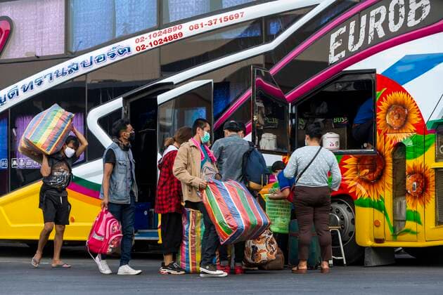 March 25, 2020, Bangkok, Bangkok, Thailand: Prime Minister Prayut Chan-O-Cha declared that starting at midnight March 26, 2020 Thailand would institute the most comprehensive lockdown procedures so far to combat the spread of Covid-19. For the third day in a row crowds of passengers gathered at Bangkok s Mochit Bus Terminal to leave the city, many making the decision to leave the Thai capital due to the mass closure of businesses causing financial burden on the city s economically insecure workforce. Bangkok Thailand - ZUMAt128 20200325_zap_t128_006 Copyright: xAdryelxTalamantesx