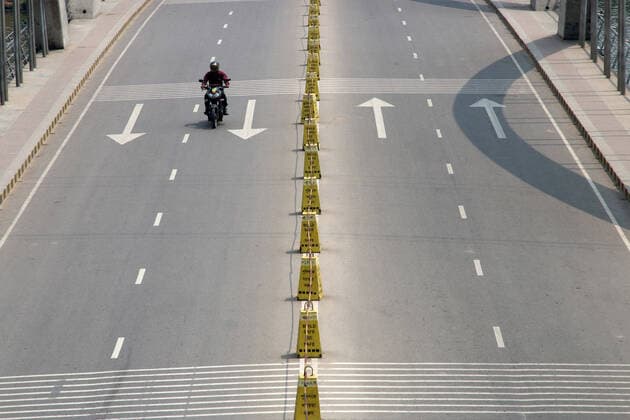 March 26, 2020, Dhaka, Bangladesh: A Bangladeshi man rides on an empty road..Death toll raised to 5 and 39 people were reported infected by COVID-19 in Bangladesh. Dhaka Bangladesh - ZUMAs197 20200326_zaa_s197_014 Copyright: xSultanxMahmudxMukutx