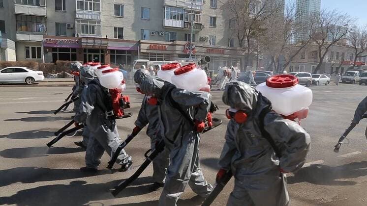 (200325) -- NUR-SULTAN, March 25, 2020 (Xinhua) -- Workers disinfect streets in Nur-Sultan, Kazakhstan, March 25, 2020. Kazakhstan has taken large-scale disinfection operations in several major cities. (Nur-Sultan City Government Handout via Xinhua) KAZAKHSTAN-NUR-SULTAN-COVID-19-DISINFECTION 