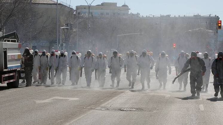 (200325) -- NUR-SULTAN, March 25, 2020 (Xinhua) -- Workers disinfect streets in Nur-Sultan, Kazakhstan, March 25, 2020. Kazakhstan has taken large-scale disinfection operations in several major cities. (Nur-Sultan City Government Handout via Xinhua) KAZAKHSTAN-NUR-SULTAN-COVID-19-DISINFECTION 