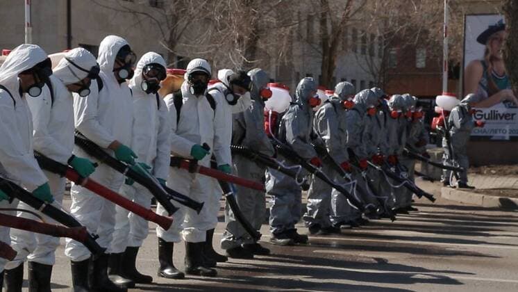 (200325) -- NUR-SULTAN, March 25, 2020 (Xinhua) -- Workers disinfect streets in Nur-Sultan, Kazakhstan, March 25, 2020. Kazakhstan has taken large-scale disinfection operations in several major cities. (Nur-Sultan City Government Handout via Xinhua) KAZAKHSTAN-NUR-SULTAN-COVID-19-DISINFECTION 