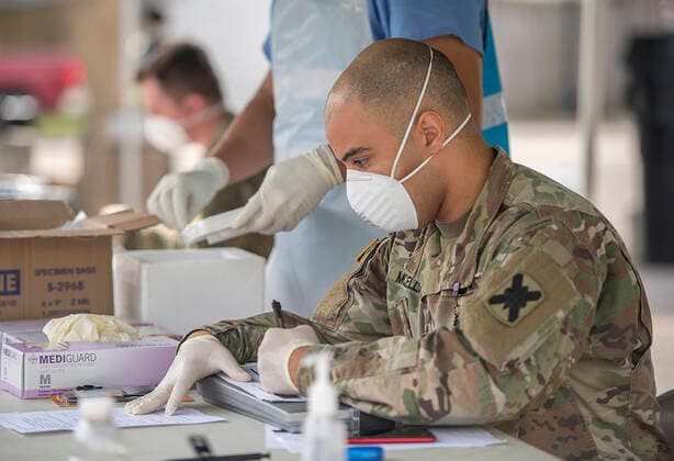 March 24, 2020, New Orleans, LA, United States: Louisiana National Guard members processes nasal swabs from patients for the COVID-19, coronavirus at a Mobile Testing Center located at Louis Armstrong Park March 24, 2020 in New Orleans, Louisiana. The testing site is one of three across New Orleans and Jefferson Parishes and will soon open to the general public. New Orleans United States - ZUMAp138 20200324_zaa_p138_044 Copyright: xDanxFarrell Planetpixx