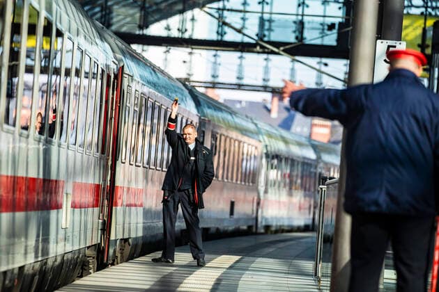 Train attendants and stationmaster at an ICE train in Berlin on 25 March 2020 To slow down the spread of the coronavirus COVID 19, the federal and state governments decided to impose further restrictions After museums, theatres, sports events etc. were banned, meetings with more than two people in public have been banned in principle fo