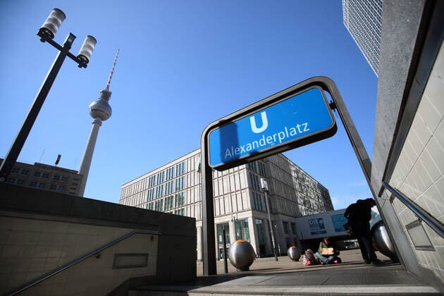 Two homeless people in front of the exit of the subway in an empty Alexanderplatz in Berlin on 25 March 2020 To slow down the spread of the coronavirus COVID 19, the federal and state governments decided to impose further restrictions After museums, theatres, sports events etc. were banned, assemblies with more th