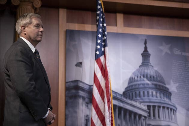 Senator Lindsey Graham (R-SC) listens to Senator Ben Sasse (R-NE) speak during a press conference on amendments on Coronavirus Stimulus Package that need changed on Capitol Hill in Washington, D.C. on Wednesday, March 25, 2020. Senate will vote on Wednesday on $2 trillion coronavirus bill after landmark agreement with White House.  WAP20200325008 TASOSxKATOPODIS