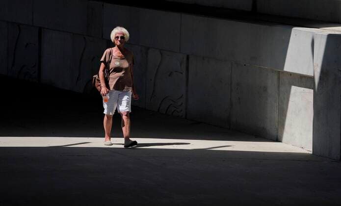 March 25, 2020, Madeira Beach, Florida, USA: A woman walks under the John s Pass Bridge on Wednesday, March 25, 2020 in Madeira Beach. Madeira Beach USA - ZUMAs70_ 20200325_zan_s70_096 Copyright: xMarthaxAsencioxRhinex