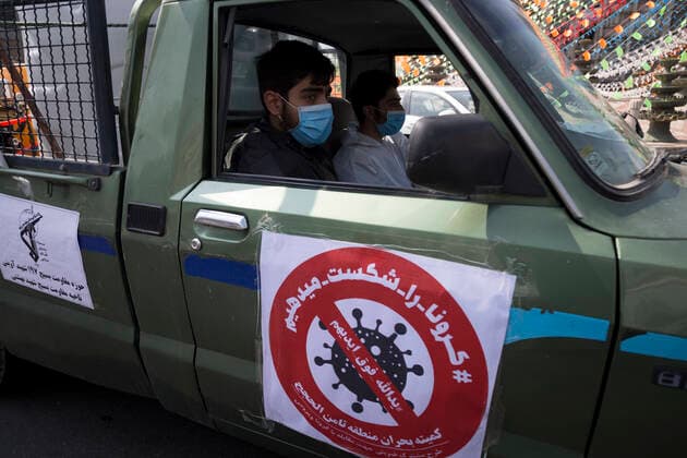 March 25, 2020, Tehran, Iran: Iran s Revolutionary Guard Corps carry out disinfection works as a preventive measure against the coronavirus (Covid-19) pandemic as part of the biological defense drill, launched in coordination with the National Headquarters For Fighting The Coronavirus, in 100 different points in Tehran, Iran. Iran launched the 3-day biological defense drill at 3,000 locations across the country. A total of 143 people in Iran have died of coronavirus over the last 24 hours, pushing the death toll up to 2,077, said Iranian health authorities on Wednesday. Italy, China, Iran, and Spain continue to be the most affected countries. Tehran Iran - ZUMAf146 20200325_zip_f146_032 Copyright: xRouzbehxFouladix