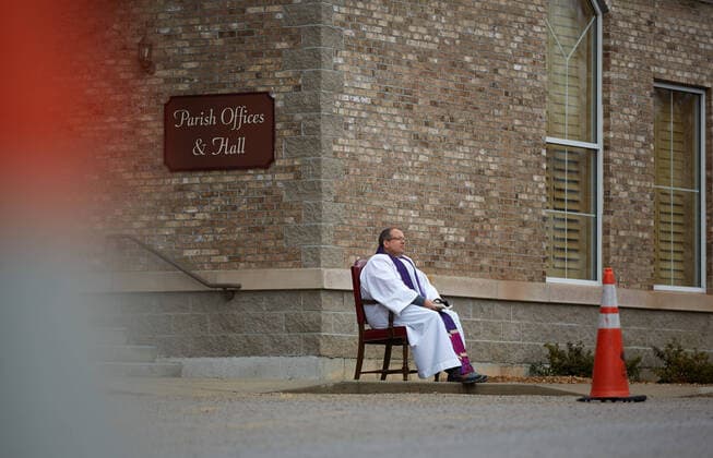 March 25, 2020, Uxbridge, Massachusetts, US: Due to COVID-19, Corona Virus, St. Mary s Church in Uxbridge, Masachusetts is holding drive up confession. The car drives up, and the seated Priest will listen and prescribe a penance and give absolution. Uxbridge US - ZUMAd211 20200325_zap_d211_002 Copyright: xAllisonxDinnerx