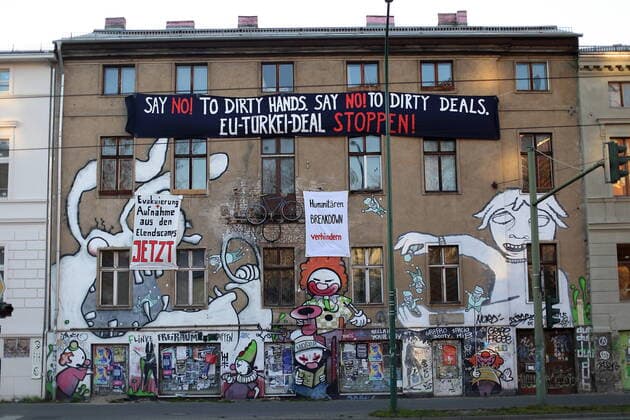 Various banners with slogans hanging on a house in Potsdam, 25 March 2020 Banner 1 Say No To Dirty Hands Say No To Dirty Deals EU Turkey Deal Stop Banner 2 Evacuation Reception from the slum camps Now Banner 3 Prevent Humanitarian Breakdown Protest Refugee Policy Potsdam