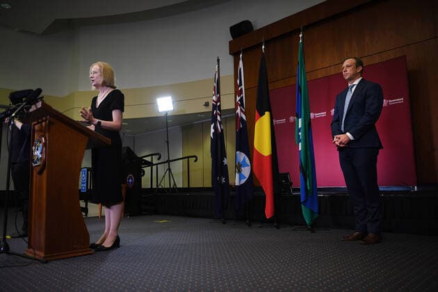 QUEENSLAND HEALTH COVID-19 PRESSER, Queensland s chief health officer Dr Jeannette Young, watched by Health Minister Steven Miles, speaks during a press conference at Parliament House in Brisbane, Thursday, March 26, 2020. Queensland schools will be student-free from next week and the state s borders have been shut due to the coronavirus COVID-19 pandemic. ( NO ARCHIVING, EDITORIAL USE ONLY, NO USE IN BOOKS WITHOUT CONSENT BRISBANE QUEENSLAND AUSTRALIA  Copyright: xDANxPELEDx 20200326001460049035