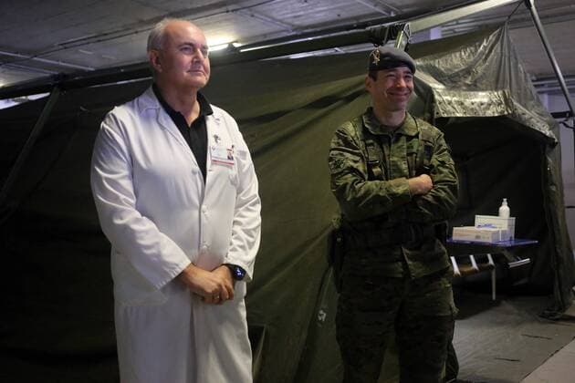 Spain: 12th day of alert status for CoVid-19 Oviedo, SPAIN: The manager of area IV of the Central University Hospital of Asturias, Luis Hevia (L) and the lieutenant colonel chief of the Toledo battalion, Javier Arrabal (R) pose for the media on day 12 of the state of alert in Spain , at the Central University Hospital of Asturias in Oviedo, Spain, on March 23, 2020. Oviedo Asturias Spain Copyright: AlbertoxBrevers