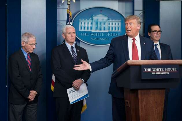 United States President Donald J. Trump delivers remarks on the COVID-19 (Coronavirus) pandemic alongside members of the Coronavirus Task Force in the Brady Press Briefing Room at the White House in Washington, DC, March 25, 2020, in Washington, D.C. Standing behind the President, from left to right: Director of the National Institute of Allergy and Infectious Diseases at the National Institutes of Health Dr. Anthony Fauci; US Vice President Mike Pence; and US Secretary of the Treasury Steven T. Mnuchin. Copyright: xSarahxSilbigerx