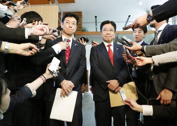 Japan s launch of new coronavirus task force Yasutoshi Nishimura (L), Japan s minister in charge of economic revitalization, and Health Minister Katsunobu Kato meet the media at the prime minister s office in Tokyo on March 26, 2020, ahead of the launch of a new coronavirus task force. A recently revised law enables Prime Minister Shinzo Abe to declare a state of emergency if necessary to cope with the outbreak. 