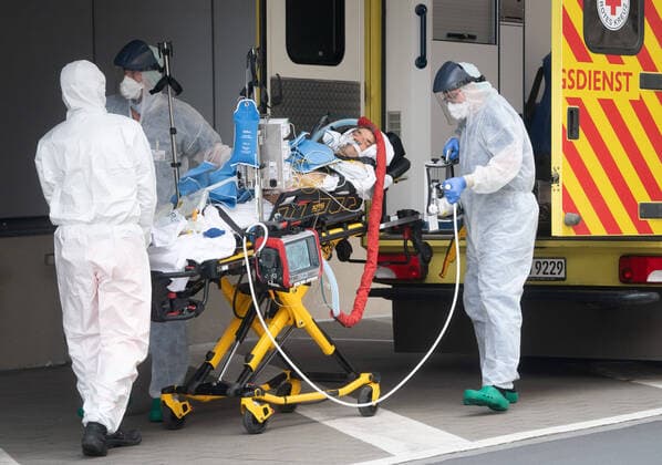 Corona patient from Italy Emergency physicians in protective clothing from Dresden University Hospital bring an Italian corona patient from an intensive care transport ambulance to the intensive care unit of Dresden University Hospital Previously, the two Italian corona patients had landed at Dresden airport with a military plane and were picked up from there with an intensive care transport ambulance
