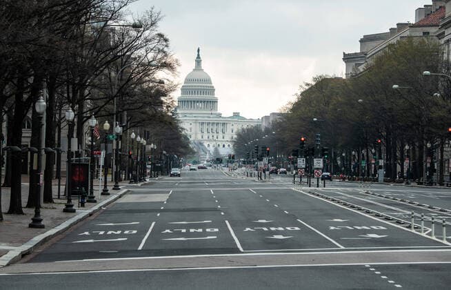 Pensylvania Ave. near the U.S. Capitol Building is seen nearly empty during the morning rush hour after DC Mayor Muriel Bowser closed all nonessential businesses to help stop the spread of the Coronavirus COVID-19, in Washington, D.C on Thursday, March 26, 2020.  WAP20200326304 KEVINxDIETSCH
