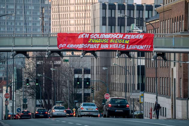 Big banner calls to stay at home, calls for solidarity, Alfredstrasse, B224, Effects of the Coronavirus Pandemic in Germany, Essen,
