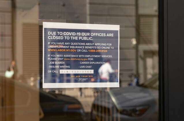 Unemployment claims soared because of COVID-19 pandemic View of Brooklyn office of NYS Department of Labor as unemployment claims in USA soared to 3.3 million in week ended March 21 because of COVID-19 pandemic. Sign on the doors asking people to apply for unemployment Online New York New York United States Copyright: LevxRadin