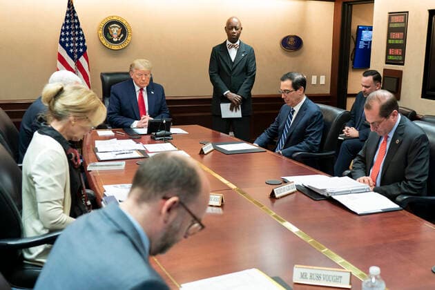 March 26, 2020, Washington, DC, United States of America: U.S President Donald Trump bows his head as Senate Chaplin Barry Black gives the prayer before the start of a video teleconference with governors on partnership to prepare, mitigate and respond to COVID-19 in the Situation Room of the White House March 26, 2020 in Washington, DC. Washington United States of America - ZUMAp138 20200326_zaa_p138_007 Copyright: xShealahxCraighead WhitexHousex