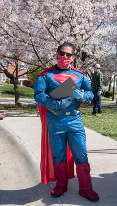 BETHESDA, MD - March 26 : Montgomery County public school district started providing students with Chrome books so that they can continue attending on-line classes during the extended shut down due to the coronavirus pandemic. Parents were told that they could pick up the chrome books at their local school. Some teachers and staff decided to lighten the mood by wearing costumes. Bethesda, Maryland on March 26, 2020. Copyright: xPatsyxLynchx