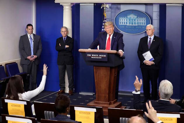March 26, 2020, Washington, District of Columbia, USA: United States President Donald J. Trump, center right, speaks as Director of the National Institute of Allergy and Infectious Diseases at the National Institutes of Health Dr. Anthony Fauci, left, and US Vice President Mike Pence, right, listen during a press briefing on the Coronavirus COVID-19 pandemic with members of the Coronavirus Task Force at the White House in Washington on March 26, 2020. .Credit: Pool via CNP Washington USA - ZUMAs152 20200326_zaa_s152_048 Copyright: xYurixGripasx