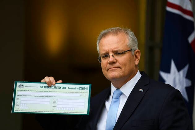 SCOTT MORRISON CORONAVIRUS UPDATE, Australian Prime Minister Scott Morrison holds up a Coronavirus Isolation Declaration Card as he speaks to the media during a press conference at Parliament House in Canberra, Friday, March 27, 2020. ( NO ARCHIVING, EDITORIAL USE ONLY, NO USE IN BOOKS WITHOUT CONSENT CANBERRA ACT AUSTRALIA  Copyright: xLUKASxCOCHx 20200327001460391250