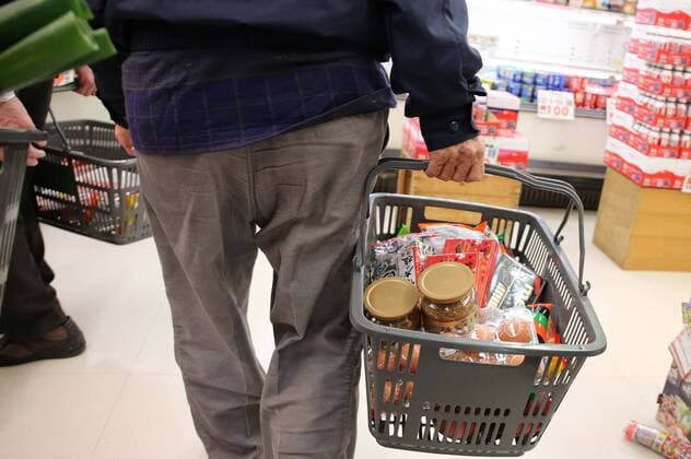 March 27, 2020, Tokyo, Japan - People buy foods and supplies in the morning at a supermarket in Tokyo, Japan on March 27, 2020. People rushed to stores to stockpile food and supplies after Tokyo governor called for residents to refrain from going outside this weekend for nonessential reasons, due to concerns over the coronavirus.  (124792457)