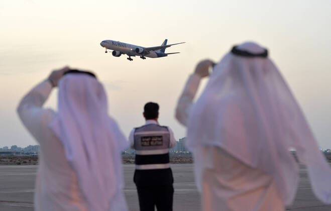 (200326) -- FARWANIYA GOVERNORATE (KUWAIT), March 26, 2020 (Xinhua) -- A plane carrying Kuwaiti citizens evacuated from abroad arrives at Kuwait International Airport in Farwaniya Governorate, Kuwait, on March 26, 2020. Kuwait reported 13 new COVID-19 cases over the past 24 hours, bringing the total number of confirmed cases in the country to 208, the Health Ministry announced Thursday. (Photo by Asad Xinhua) KUWAIT-FARWANIYA GOVERNORATE-COVID-19-MEASURES 