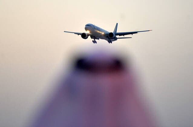 (200326) -- FARWANIYA GOVERNORATE (KUWAIT), March 26, 2020 (Xinhua) -- A plane carrying Kuwaiti citizens evacuated from abroad arrives at Kuwait International Airport in Farwaniya Governorate, Kuwait, on March 26, 2020. Kuwait reported 13 new COVID-19 cases over the past 24 hours, bringing the total number of confirmed cases in the country to 208, the Health Ministry announced Thursday. (Photo by Asad Xinhua) KUWAIT-FARWANIYA GOVERNORATE-COVID-19-MEASURES 