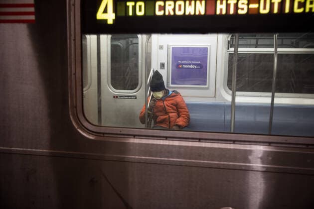 (200327) -- NEW YORK, March 27, 2020 -- A person with a face mask is seen in a subway train in New York, the United States, March 26, 2020. The United States reported 82,404 confirmed COVID-19 cases as of 6 p.m. U.S. Eastern Time on Thursday (2200 GMT), according to the Center for Systems Science and Engineering (CSSE) at Johns Hopkins University. The United States has surpassed China to become the country with most COVID-19 cases in the world, according to the CSSE. (Photo by Michael Nagle Xinhua) U.S.-NEW YORK-COVID-19-CASES MxIchaelNagle wangying 